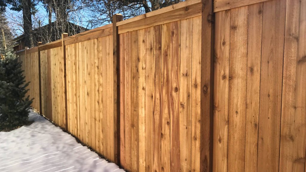 cap and trim wood privacy fence build in north georgia