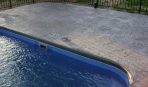 stamped gray concrete around pool in buford, georgia